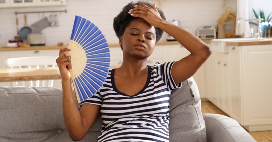 woman sweating in home
