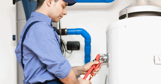 Plumber servicing a water heater.