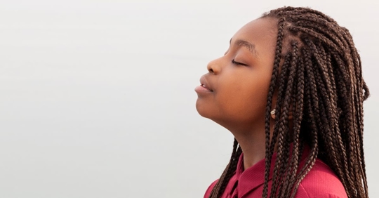 woman taking deep breathe